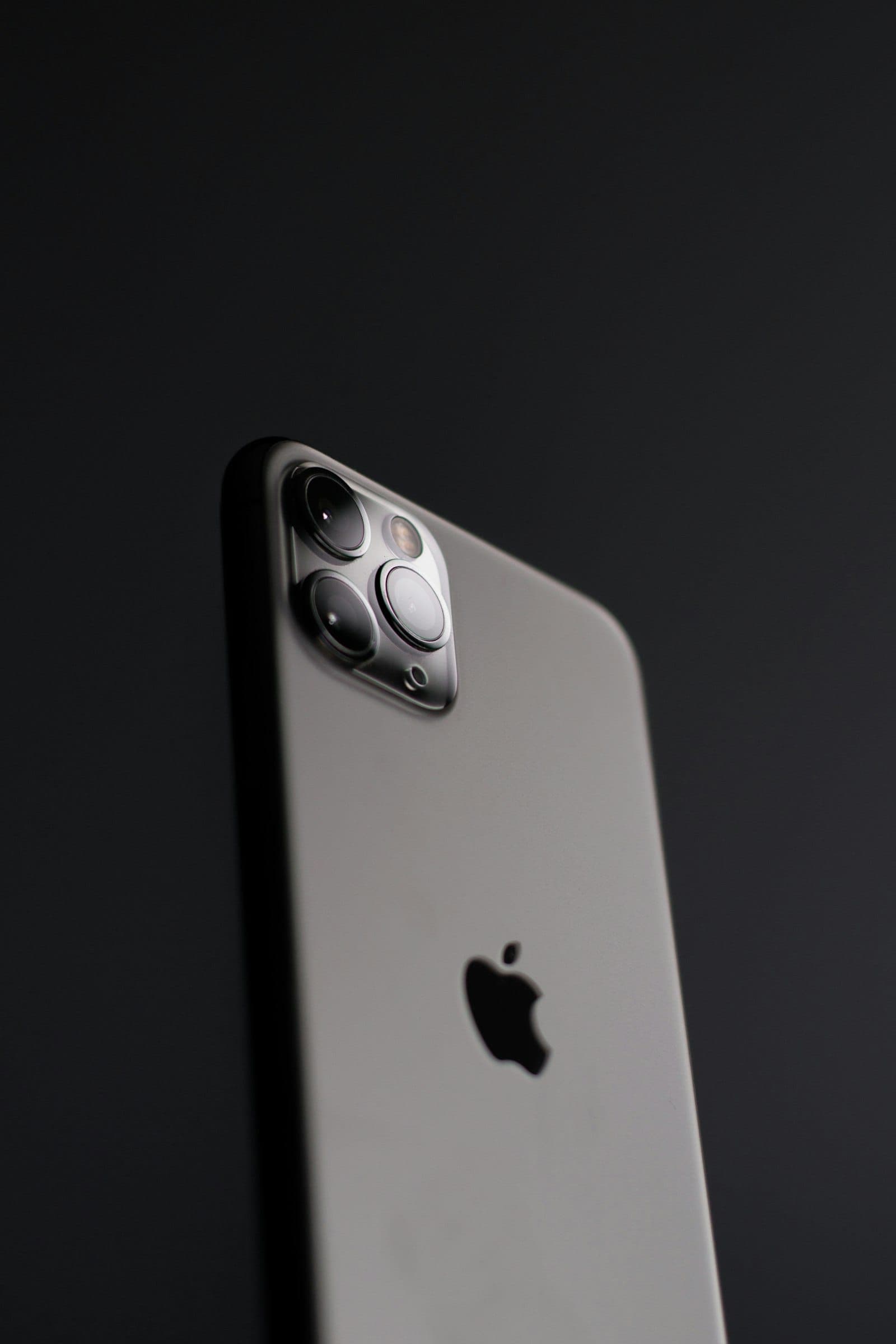 Back of a space-grey iPhone Pro showing the triple camera module